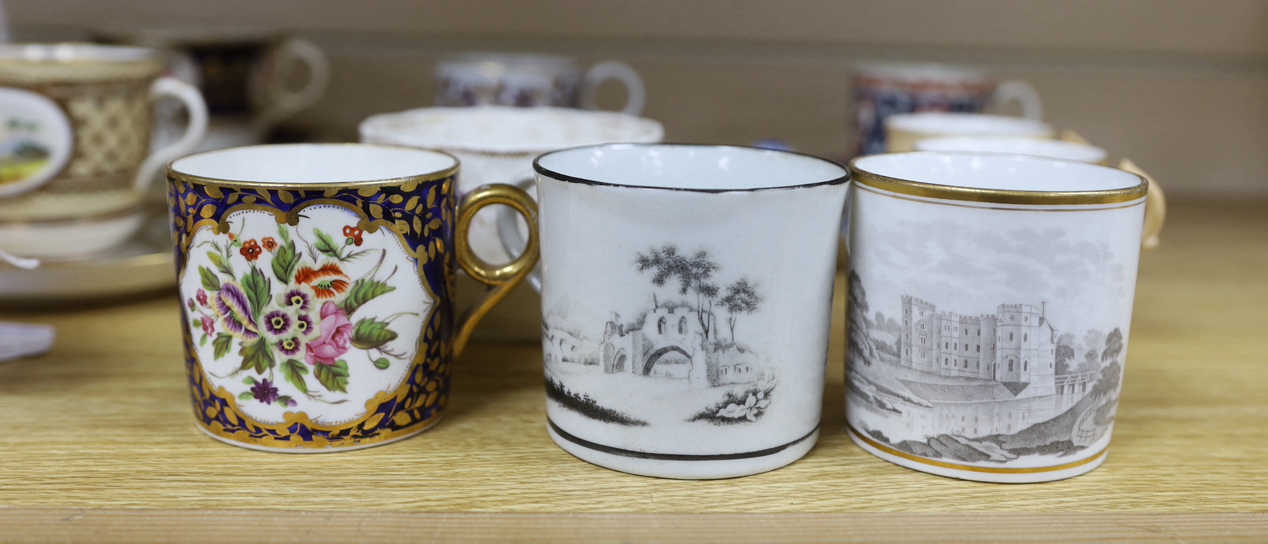 A collection of 18th and 19th century English and continental tea and coffee cups some with saucers, including a Worcester Queen Charlotte pattern coffee cup and saucer